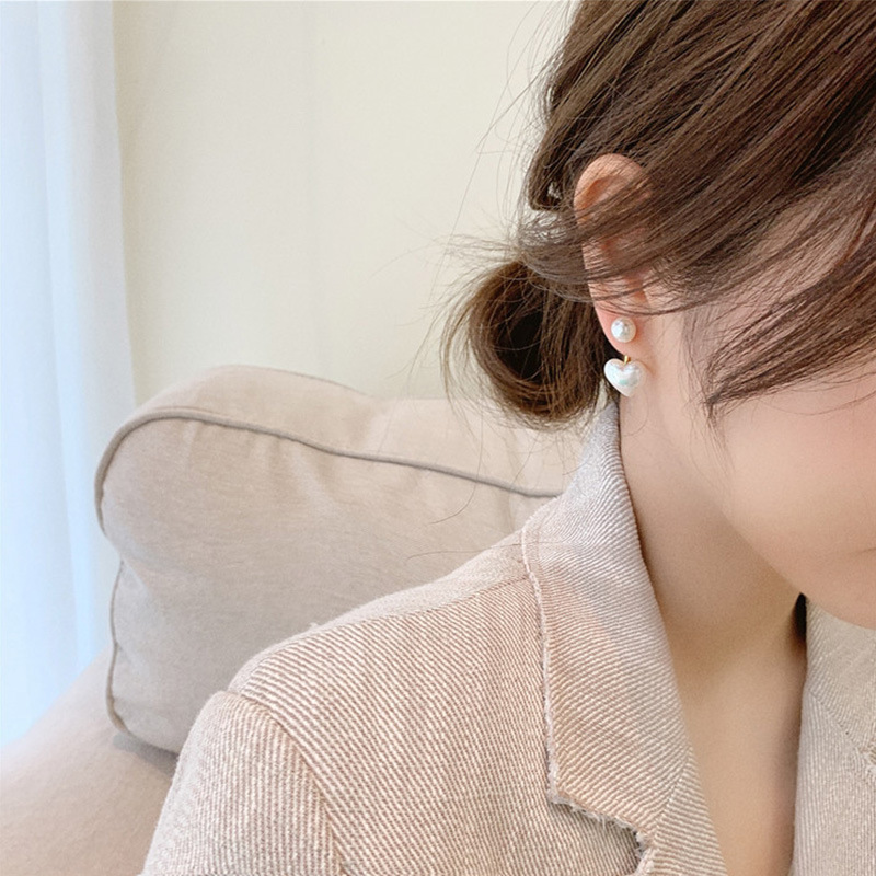 Pearl Heart Stud Earrings — close-up detail
