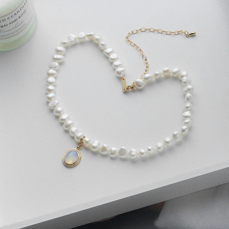 Medallion & Pearl Necklace — close-up detail