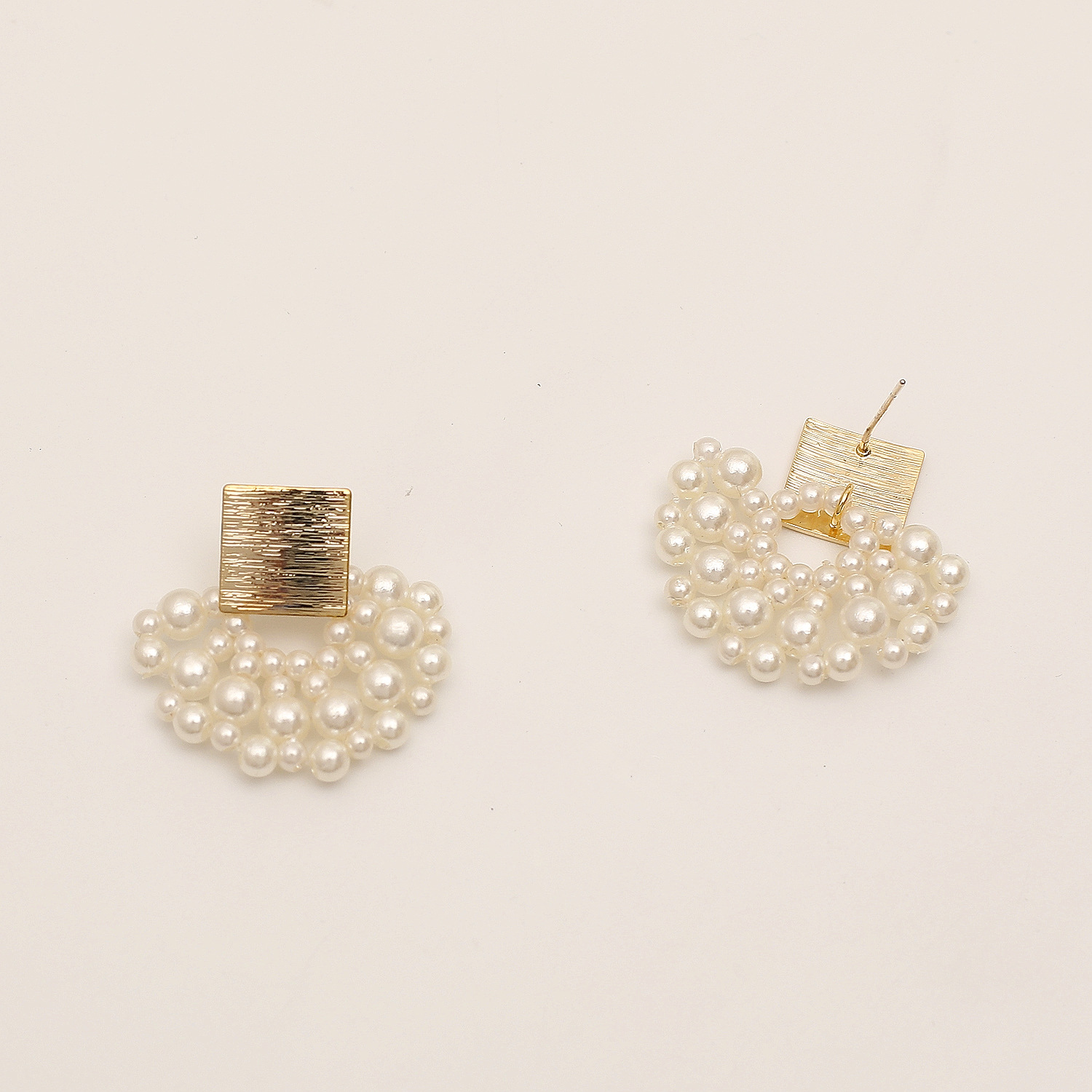 Woven Pearl Stud Earrings — close-up detail